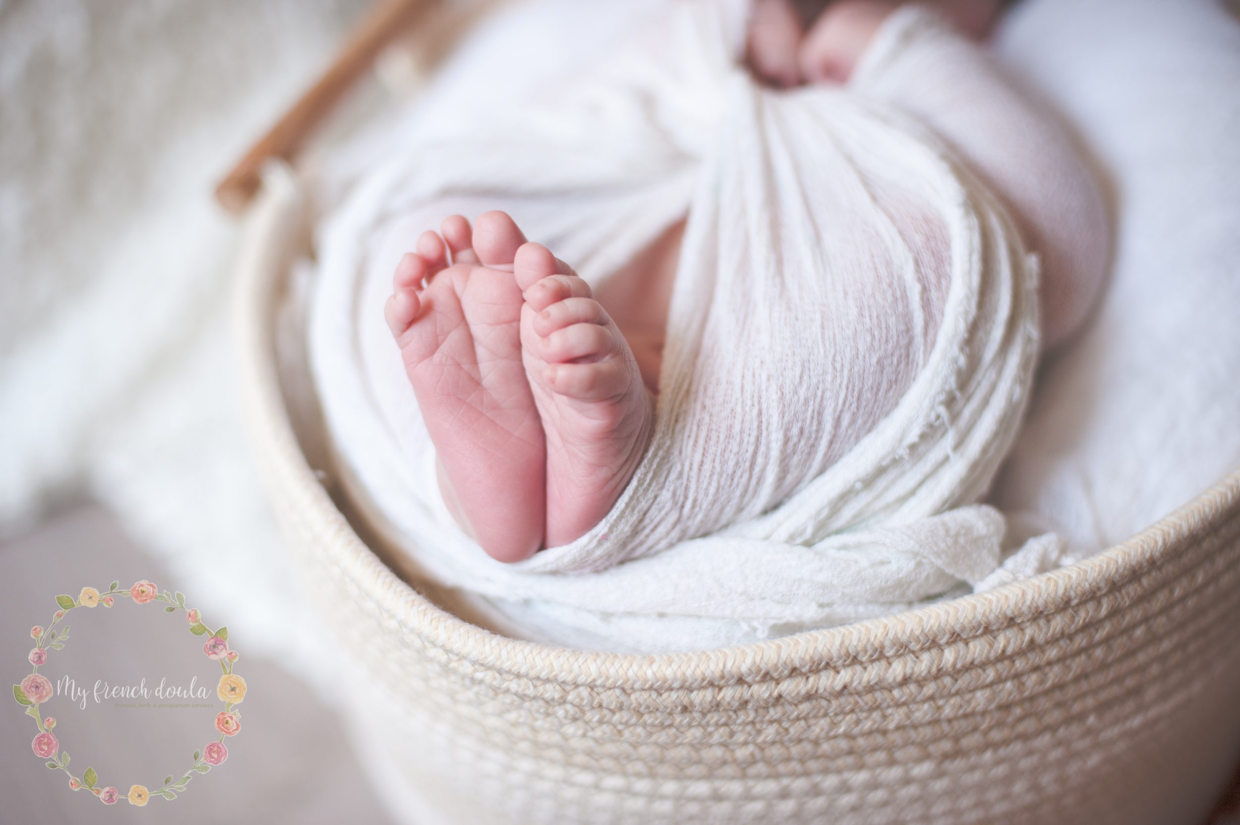 A close-up of a newborn’s tiny feet